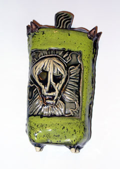 Green skull vase